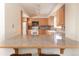 Open kitchen featuring wooden cabinetry, breakfast bar and bright light at 218 Highland Ter, Breckenridge, CO 80424