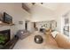 Large living room featuring a fireplace, modern furniture and beautiful natural lighting at 218 Highland Ter, Breckenridge, CO 80424
