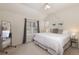 Bright main bedroom features ceiling fan, large windows, neutral tones and mirror at 218 Highland Ter, Breckenridge, CO 80424