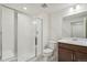 Bright bathroom featuring a glass-enclosed shower, modern vanity, and contemporary fixtures at 9314 Biscay St, Commerce City, CO 80022