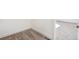 Neutral carpeted bedroom with white baseboards and walls, showcasing a clean, bright, and modern interior at 9314 Biscay St, Commerce City, CO 80022