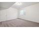 Neutral bedroom showcasing soft carpeting, a window, and ample closet space at 9314 Biscay St, Commerce City, CO 80022
