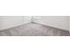 Neutral carpeted bedroom with white baseboards and walls, featuring a clean, bright, and modern interior at 9314 Biscay St, Commerce City, CO 80022
