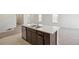 Kitchen island with double sink, granite counter top and stainless steel dishwasher at 9314 Biscay St, Commerce City, CO 80022