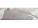 Expansive living space with plush carpeting and bright, white walls at 9314 Biscay St, Commerce City, CO 80022