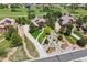 Breathtaking aerial view of an estate home with meticulously landscaped grounds and a circular driveway at 4651 Sonado Pl, Parker, CO 80134