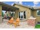 Inviting back patio featuring a brick grill and outdoor seating for relaxing and entertaining in style at 4651 Sonado Pl, Parker, CO 80134
