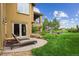 Lush backyard with a well-manicured lawn, patio furniture, and a charming outdoor seating area at 4651 Sonado Pl, Parker, CO 80134