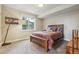 Cozy bedroom with a comfortable bed, soft carpeting, and a large window offering natural light at 4651 Sonado Pl, Parker, CO 80134