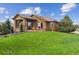 Charming home exterior featuring a covered patio and well-maintained landscaping at 4651 Sonado Pl, Parker, CO 80134
