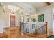 Grand foyer showcasing a hardwood floor, beautiful staircase, and elegant lighting fixtures at 4651 Sonado Pl, Parker, CO 80134