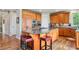 Well-equipped kitchen featuring a large island, custom cabinetry, and modern appliances at 4651 Sonado Pl, Parker, CO 80134