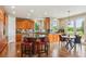 Gourmet kitchen with custom cabinets, granite countertops, and stainless steel appliances at 4651 Sonado Pl, Parker, CO 80134