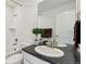 Bathroom featuring a combined shower and tub, stylish vanity, and neutral finishes at 17692 Olive St, Broomfield, CO 80023