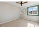 Bedroom featuring light gray walls, green trim and a flower design on the wall at 17692 Olive St, Broomfield, CO 80023