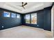 Spacious bedroom featuring a trey ceiling, fan, and large windows offering neighborhood views at 17692 Olive St, Broomfield, CO 80023
