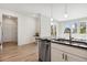 Modern kitchen featuring stainless steel appliances and black countertops at 17692 Olive St, Broomfield, CO 80023