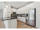 Modern kitchen featuring stainless steel appliances and sleek countertops at 17692 Olive St, Broomfield, CO 80023