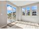 Bright room with sliding glass doors leading to a deck, offering outdoor views at 17692 Olive St, Broomfield, CO 80023