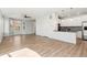 Open-concept living space with wood floors, large windows, and modern finishes at 17692 Olive St, Broomfield, CO 80023