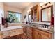 Luxurious bathroom with double vanity, soaking tub, and a view at 8002 Galileo Way, Littleton, CO 80125