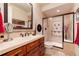 Bathroom with a large vanity and a walk-in shower at 8002 Galileo Way, Littleton, CO 80125