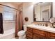 Bathroom with a tub, shower, and updated vanity at 8002 Galileo Way, Littleton, CO 80125