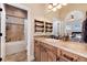 Elegant bathroom with a large vanity, tile shower, and updated fixtures at 8002 Galileo Way, Littleton, CO 80125