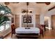 Formal dining room with an oval table, chandelier, and built-in cabinetry at 8002 Galileo Way, Littleton, CO 80125