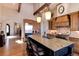 Island kitchen with granite countertops and high-end stainless steel appliances at 8002 Galileo Way, Littleton, CO 80125