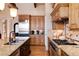 Modern kitchen with stainless steel appliances and ample counter space at 8002 Galileo Way, Littleton, CO 80125