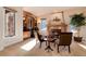 Cozy library featuring built-in bookshelves, a fireplace, and comfortable seating at 8002 Galileo Way, Littleton, CO 80125