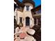 Inviting patio with seating area and ornate front entrance at 8002 Galileo Way, Littleton, CO 80125