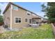 Landscaped backyard features a spacious lawn, patio, and well-maintained garden, perfect for outdoor enjoyment at 14058 Elizabeth St, Thornton, CO 80602