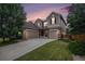 Charming two-story home with a three-car garage and well-manicured lawn at 14058 Elizabeth St, Thornton, CO 80602
