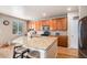 Kitchen with a large island and stainless steel appliances at 14058 Elizabeth St, Thornton, CO 80602