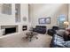 Living room featuring a fireplace and high ceilings at 14058 Elizabeth St, Thornton, CO 80602