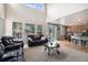 Open living room with a view into the kitchen and access to the backyard at 14058 Elizabeth St, Thornton, CO 80602