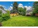 Well-maintained and manicured large lawn with beautiful fenced backyard at 13112 Summit Grove Pkwy, Thornton, CO 80241