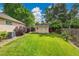 The home has a well-manicured backyard featuring a lush lawn, a storage shed, and privacy fencing at 13112 Summit Grove Pkwy, Thornton, CO 80241