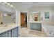 Airy bathroom with double sinks and a bathtub provides a spa-like experience at 13112 Summit Grove Pkwy, Thornton, CO 80241
