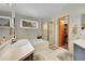 Bright bathroom with double sinks, soaking tub, and separate shower for added convenience at 13112 Summit Grove Pkwy, Thornton, CO 80241