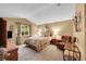 Comfortable bedroom with a serene ambiance, neutral colors, and ample natural light at 13112 Summit Grove Pkwy, Thornton, CO 80241