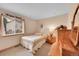 Cozy bedroom with a window view and a dresser for a restful night's sleep at 13112 Summit Grove Pkwy, Thornton, CO 80241