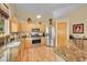 Bright kitchen features granite countertops, stainless steel appliances, and wooden cabinets at 13112 Summit Grove Pkwy, Thornton, CO 80241