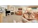 Warm and inviting living room with a fireplace, comfortable seating, and ample natural light at 13112 Summit Grove Pkwy, Thornton, CO 80241