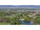 Beautiful aerial view showcasing the neighborhood, lush greenery, community golf course, and mountain views at 3985 W 104Th Dr # E, Westminster, CO 80031