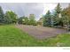 Community basketball court surrounded by manicured lawns, mature trees, and a charming covered picnic structure at 3985 W 104Th Dr # E, Westminster, CO 80031