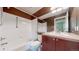 Full bathroom featuring tub-shower combo, and ample cabinet space at 3985 W 104Th Dr # E, Westminster, CO 80031
