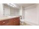 Bathroom featuring a large mirror, sink, cabinets, and a shower and tub at 3985 W 104Th Dr # E, Westminster, CO 80031